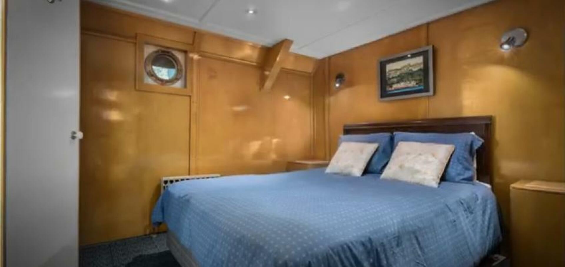 a bed in a room aboard PRESCOTONT Yacht for Sale
