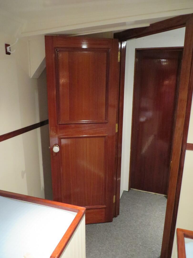 a wooden door in a room aboard PRESCOTONT Yacht for Sale