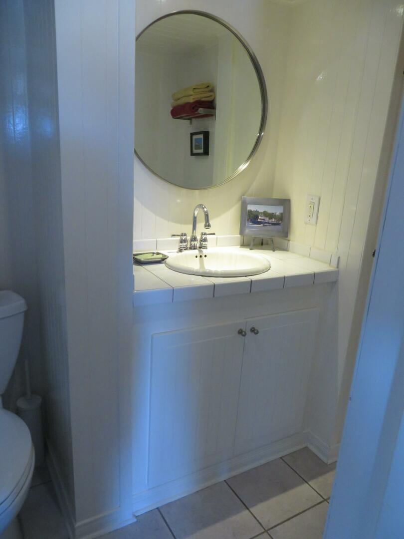 a bathroom with a sink and a mirror aboard PRESCOTONT Yacht for Sale