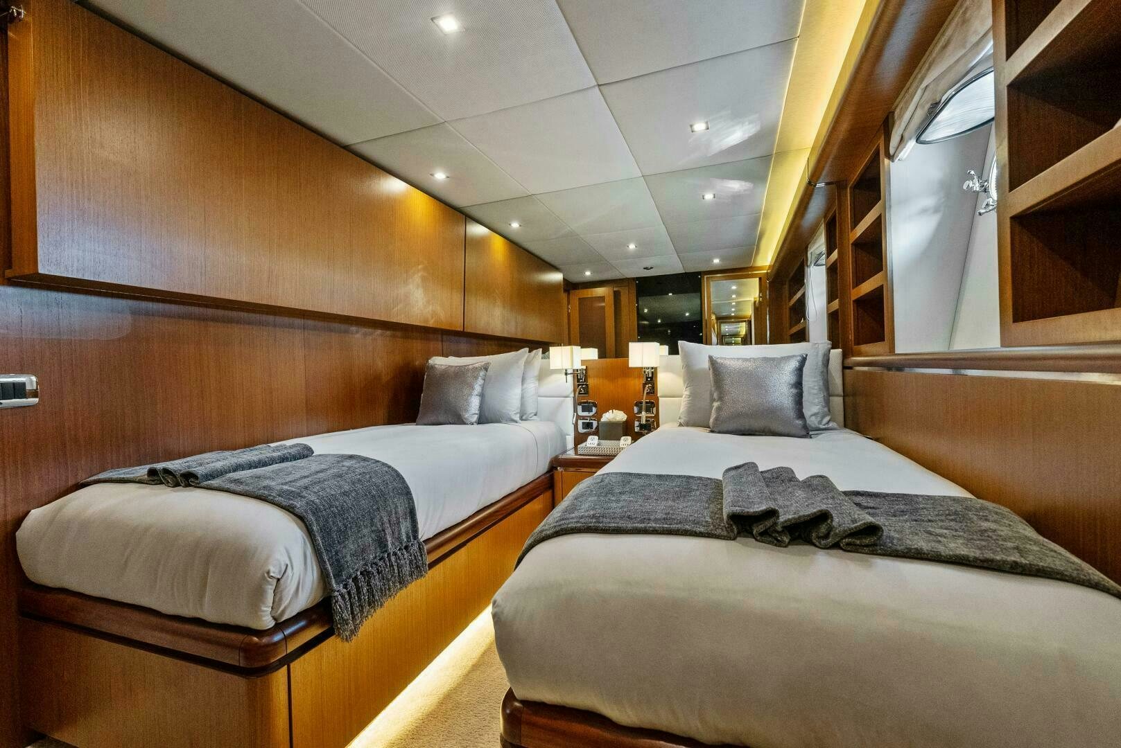 a room with two beds aboard PRINCESS LONA Yacht for Sale