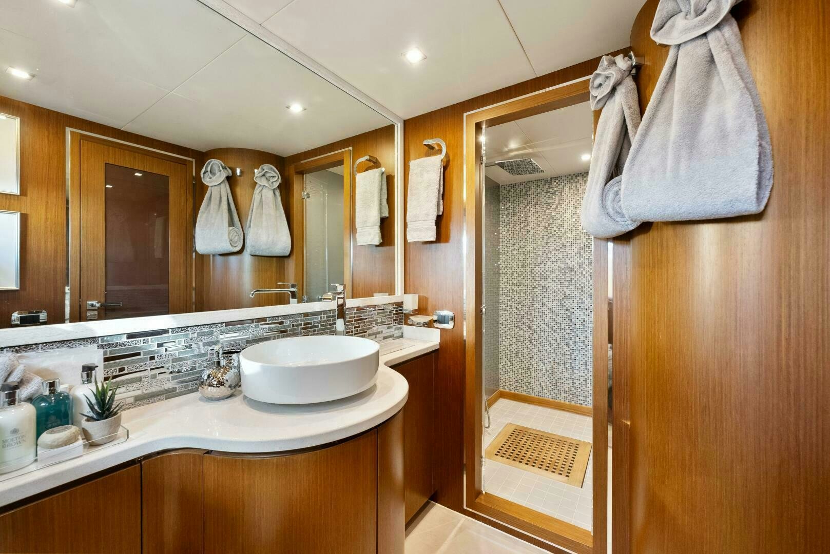 a bathroom with a sink and a mirror aboard PRINCESS LONA Yacht for Sale
