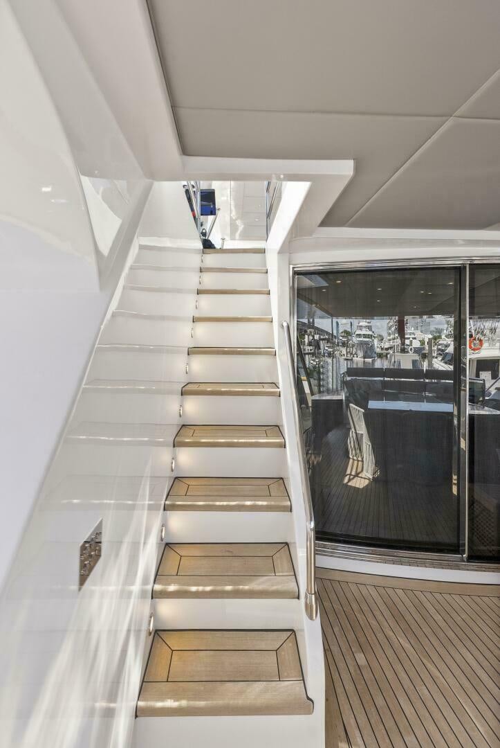 a staircase with glass doors aboard PRINCESS LONA Yacht for Sale