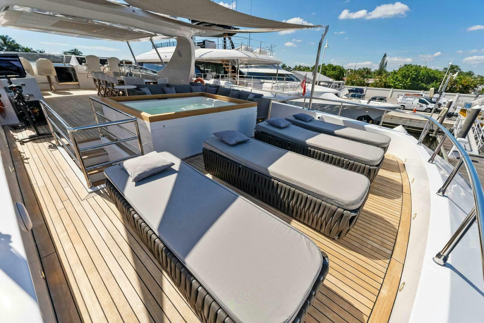 a deck with a deck and a pool aboard PRINCESS LONA Yacht for Sale
