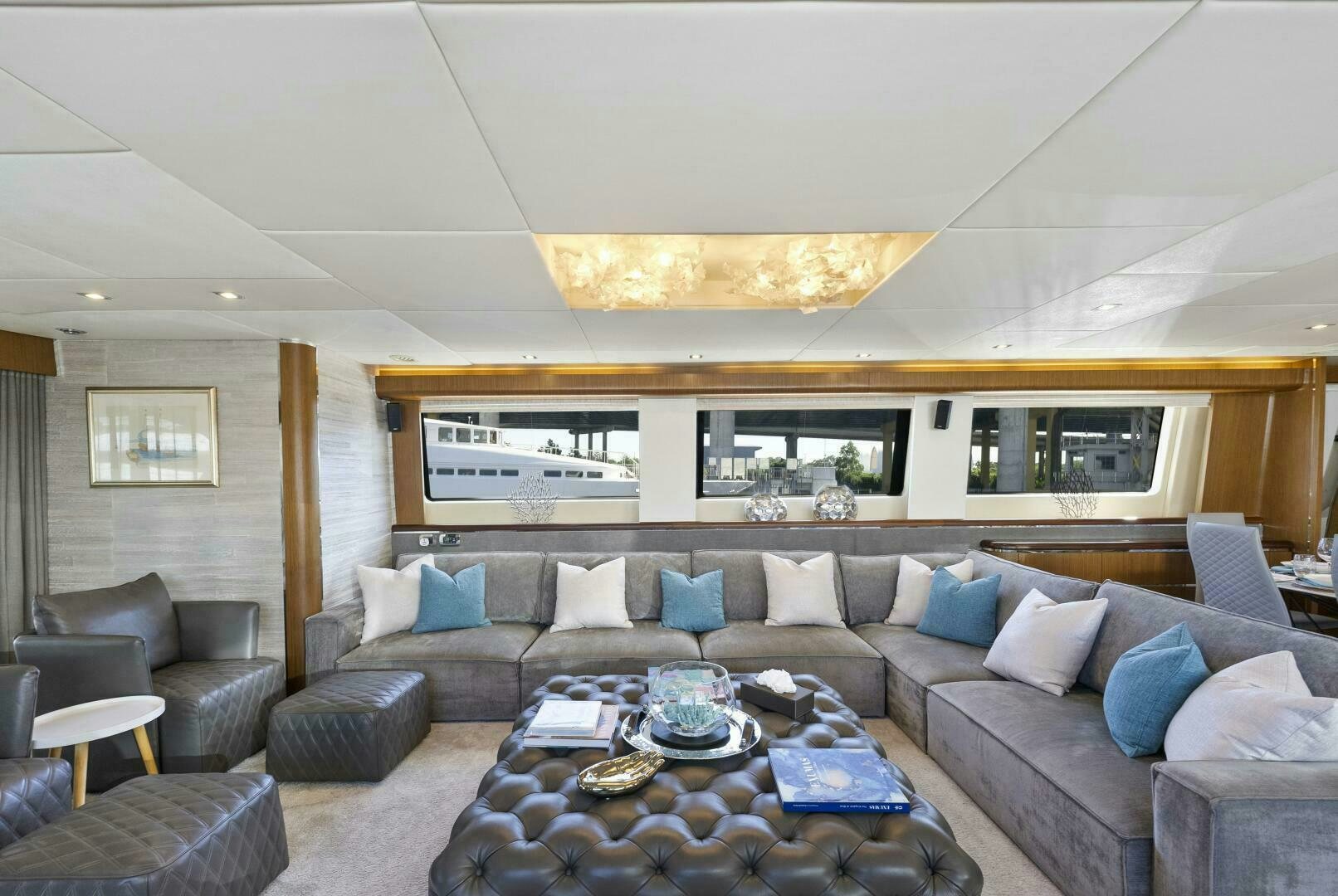 a living room with a sectional sofa aboard PRINCESS LONA Yacht for Sale