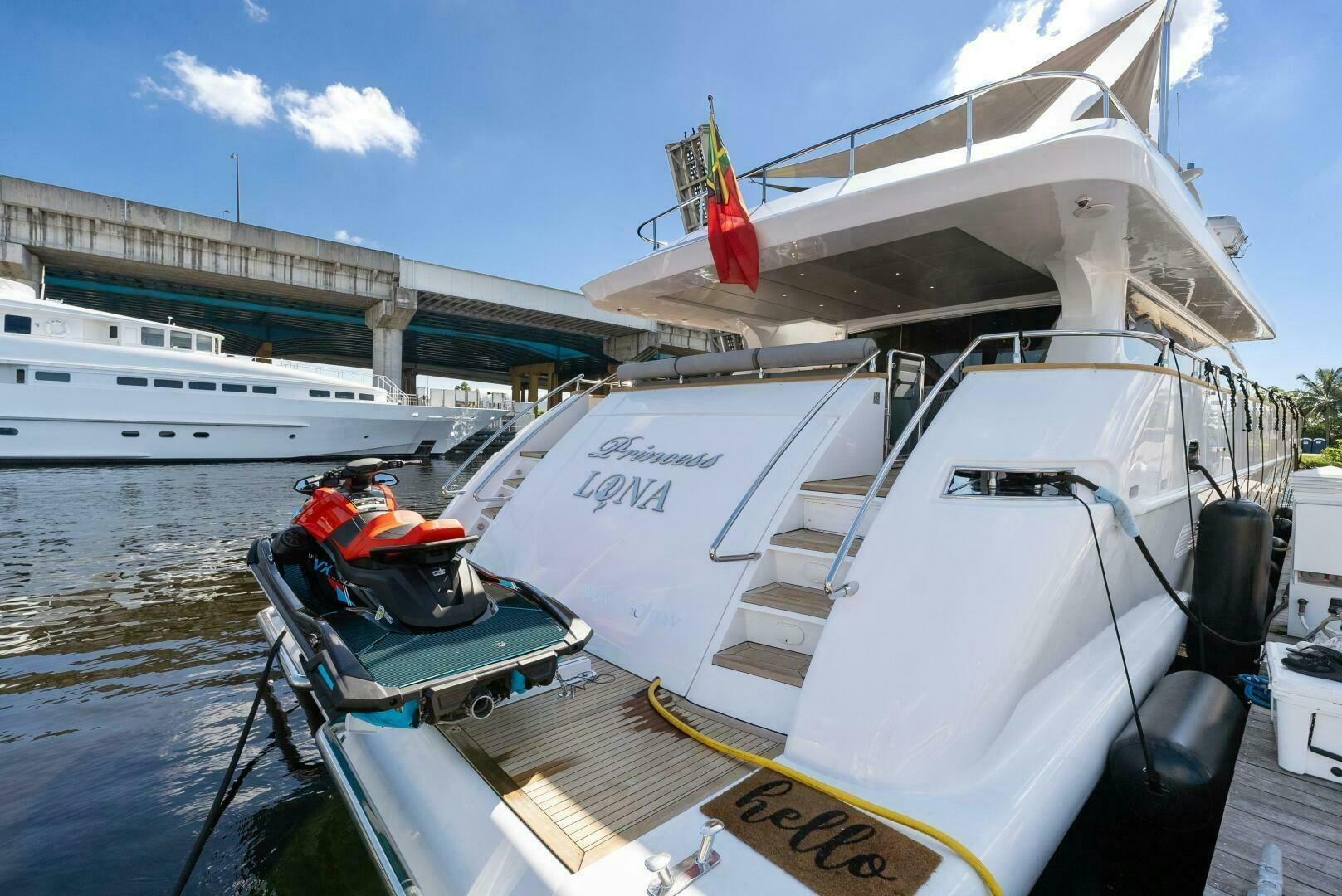 a boat with a red and white flag on it aboard PRINCESS LONA Yacht for Sale