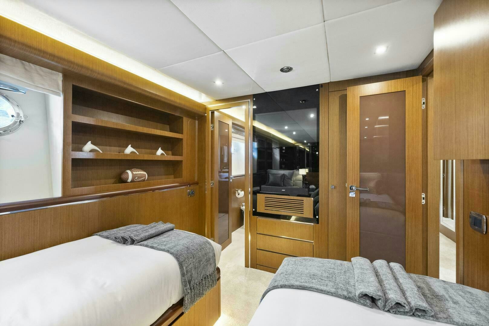 a bedroom with a bunk bed and a closet aboard PRINCESS LONA Yacht for Sale