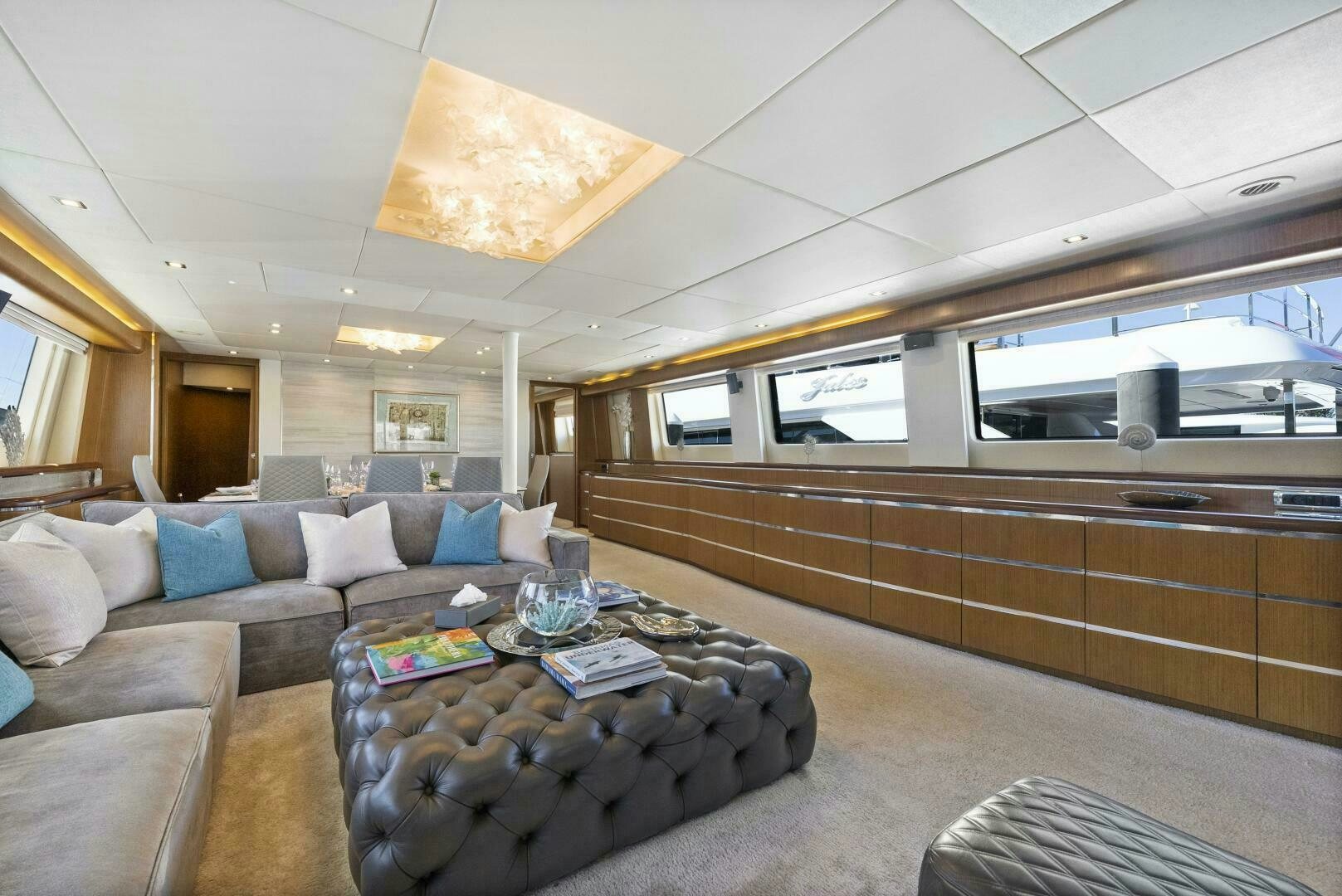 a living room with a couch and a coffee table aboard PRINCESS LONA Yacht for Sale