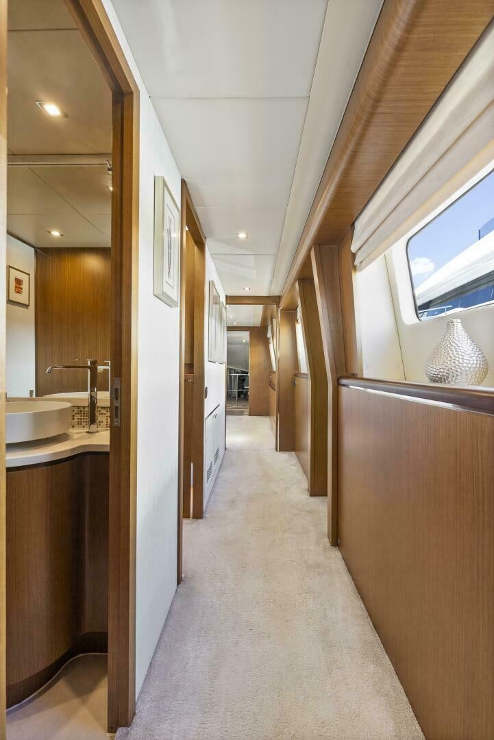 a hallway with a sink and a mirror aboard PRINCESS LONA Yacht for Sale