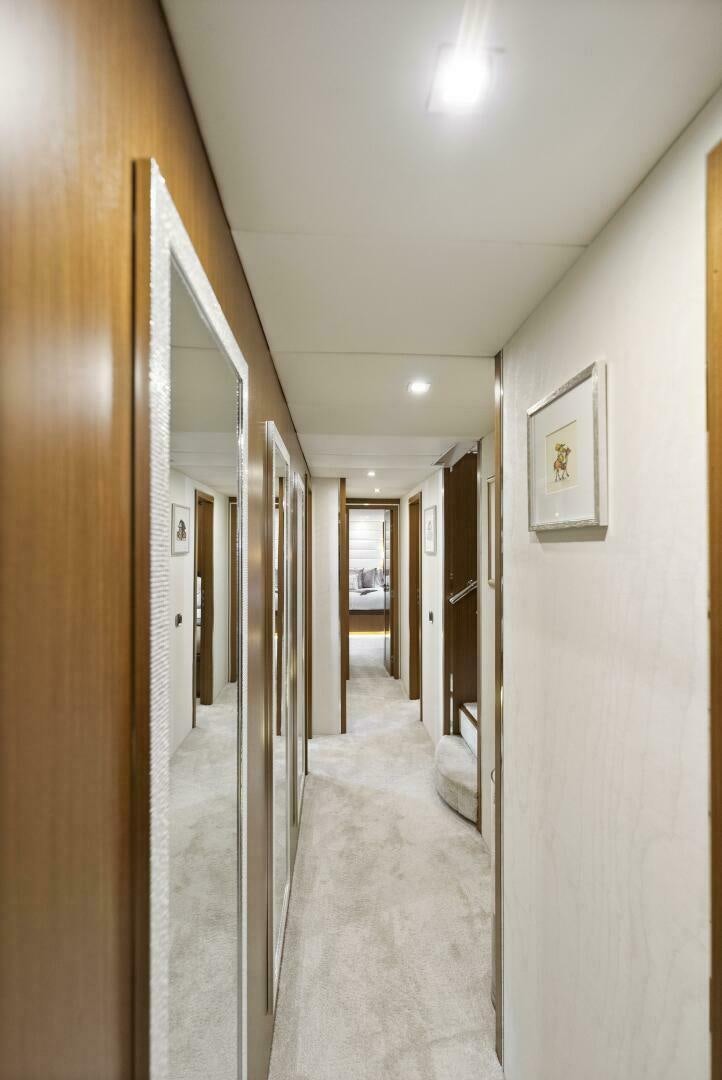 a hallway with a door and a hallway aboard PRINCESS LONA Yacht for Sale