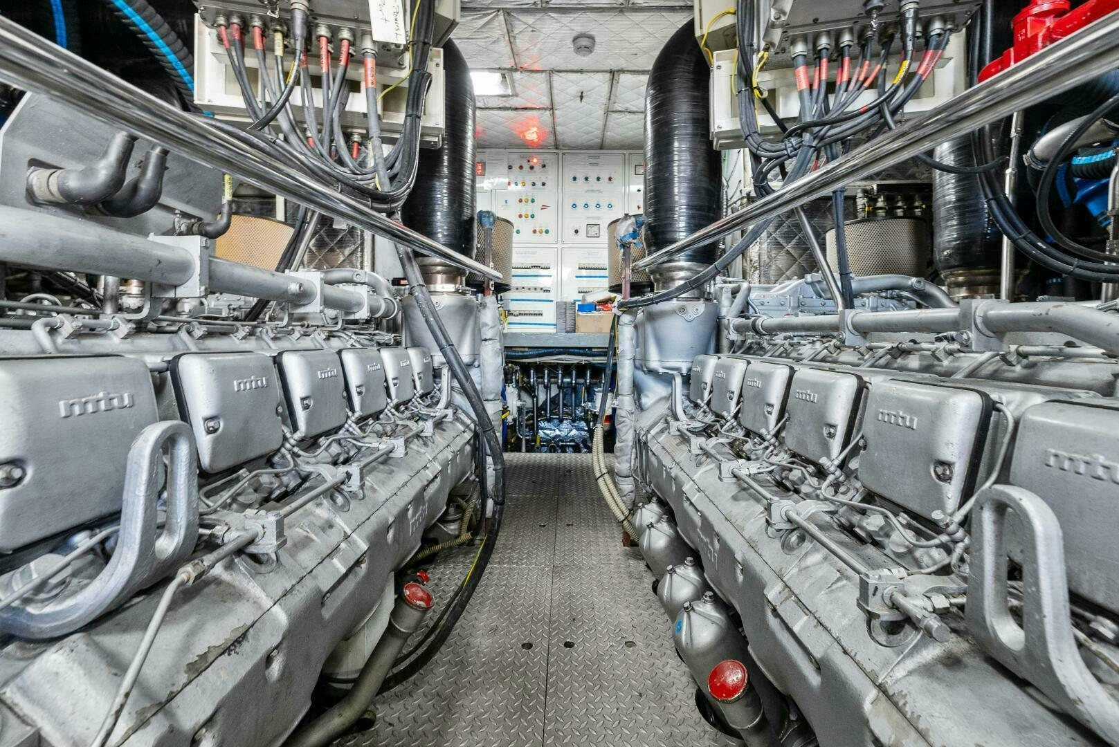 a room with several pipes aboard PRINCESS LONA Yacht for Sale