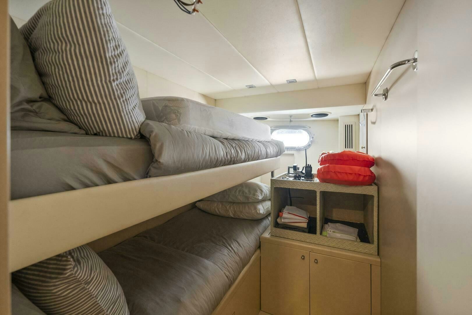 a room with a bed and a desk aboard PRINCESS LONA Yacht for Sale
