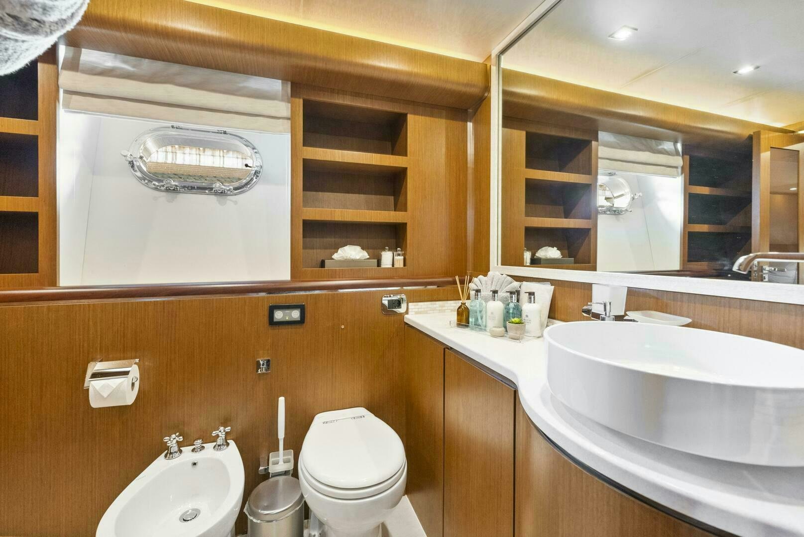 a bathroom with a sink toilet and a mirror aboard PRINCESS LONA Yacht for Sale