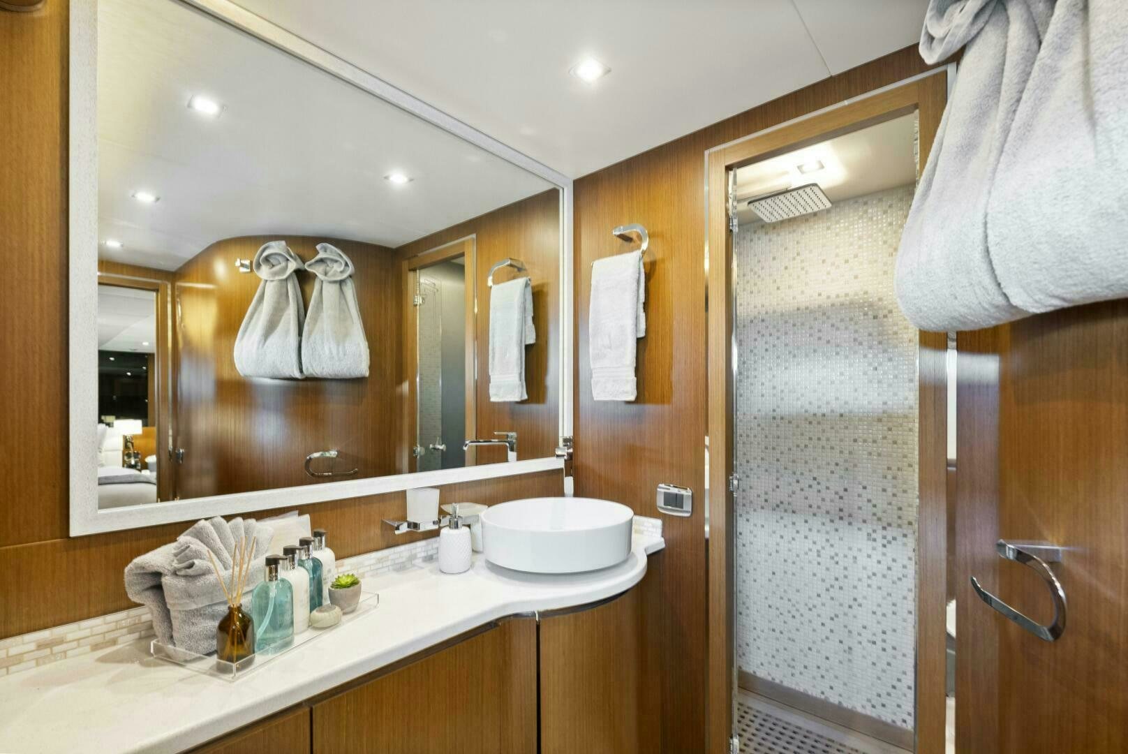 a bathroom with a large mirror aboard PRINCESS LONA Yacht for Sale