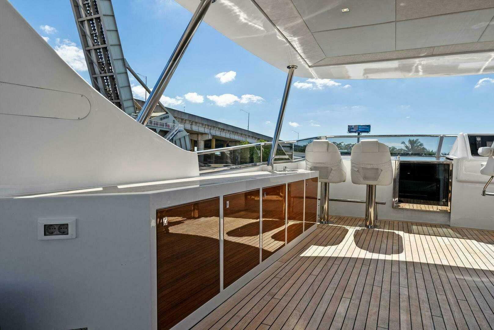 a deck with a boat and chairs aboard PRINCESS LONA Yacht for Sale