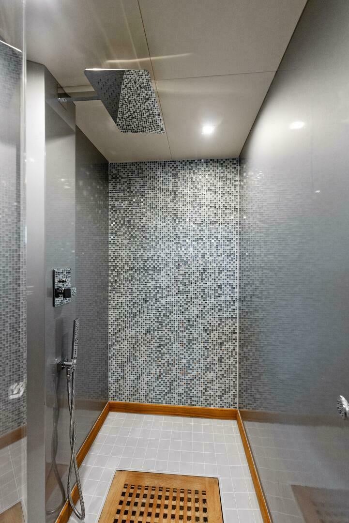 a shower with a tile floor aboard PRINCESS LONA Yacht for Sale