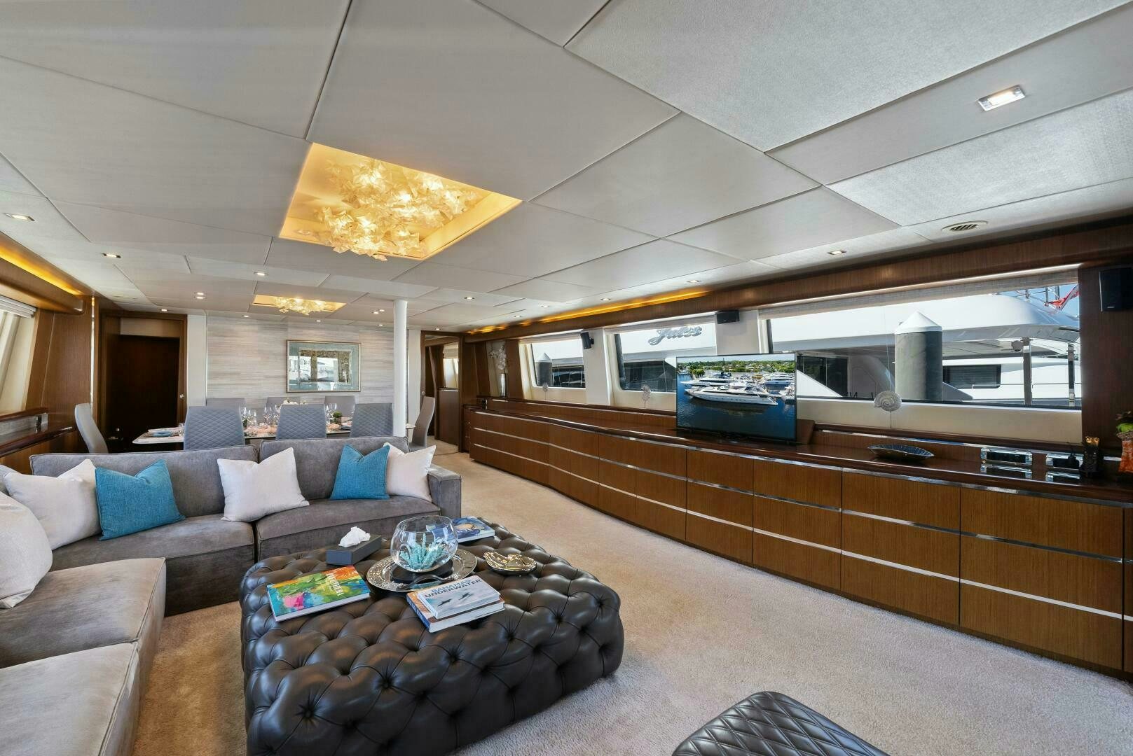 a living room with a couch and a coffee table aboard PRINCESS LONA Yacht for Sale