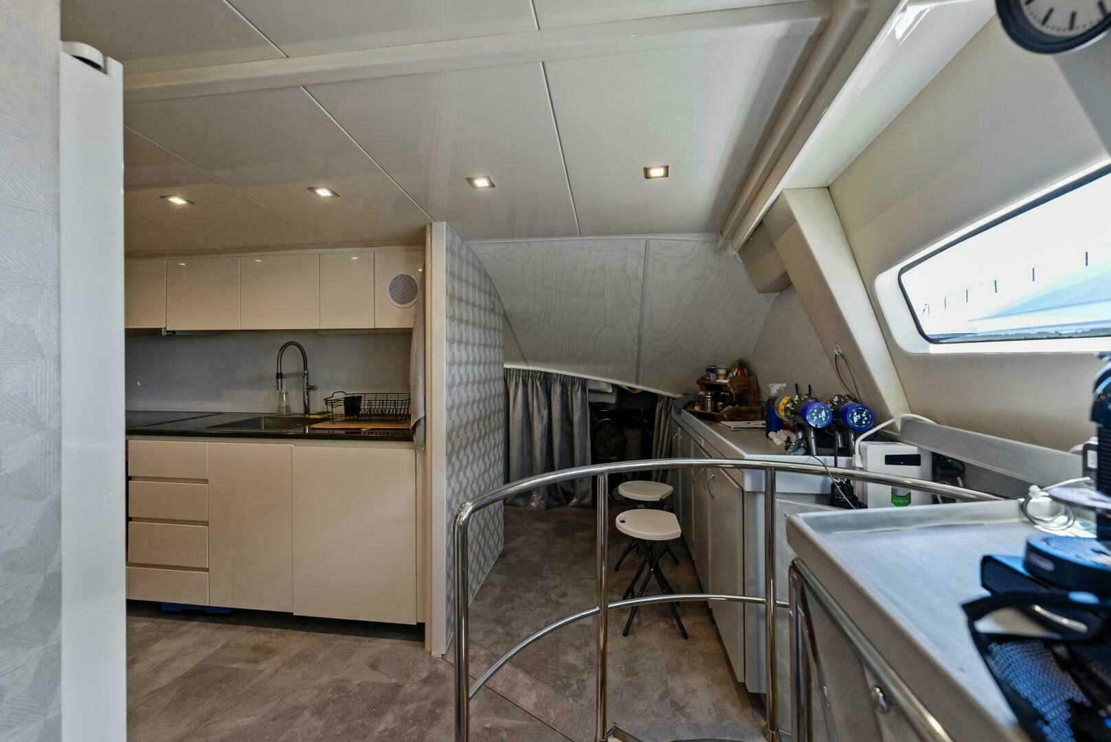 a kitchen with white cabinets aboard PRINCESS LONA Yacht for Sale