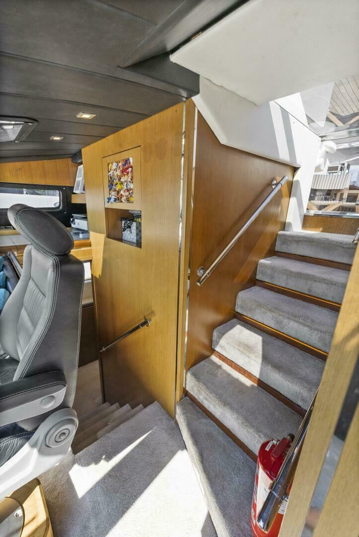 a wooden staircase in a room aboard PRINCESS LONA Yacht for Sale