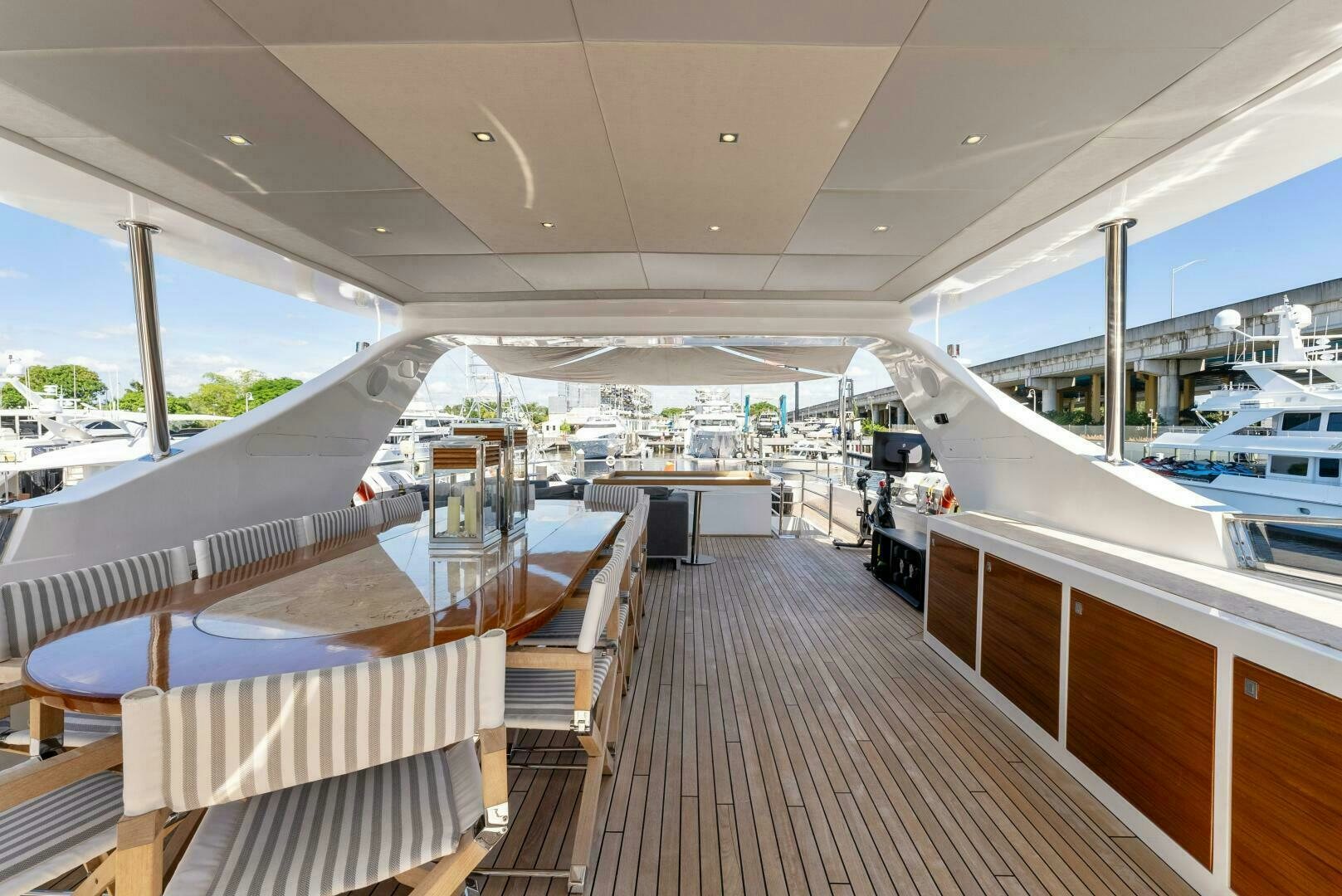 a deck with a boat and a large window aboard PRINCESS LONA Yacht for Sale