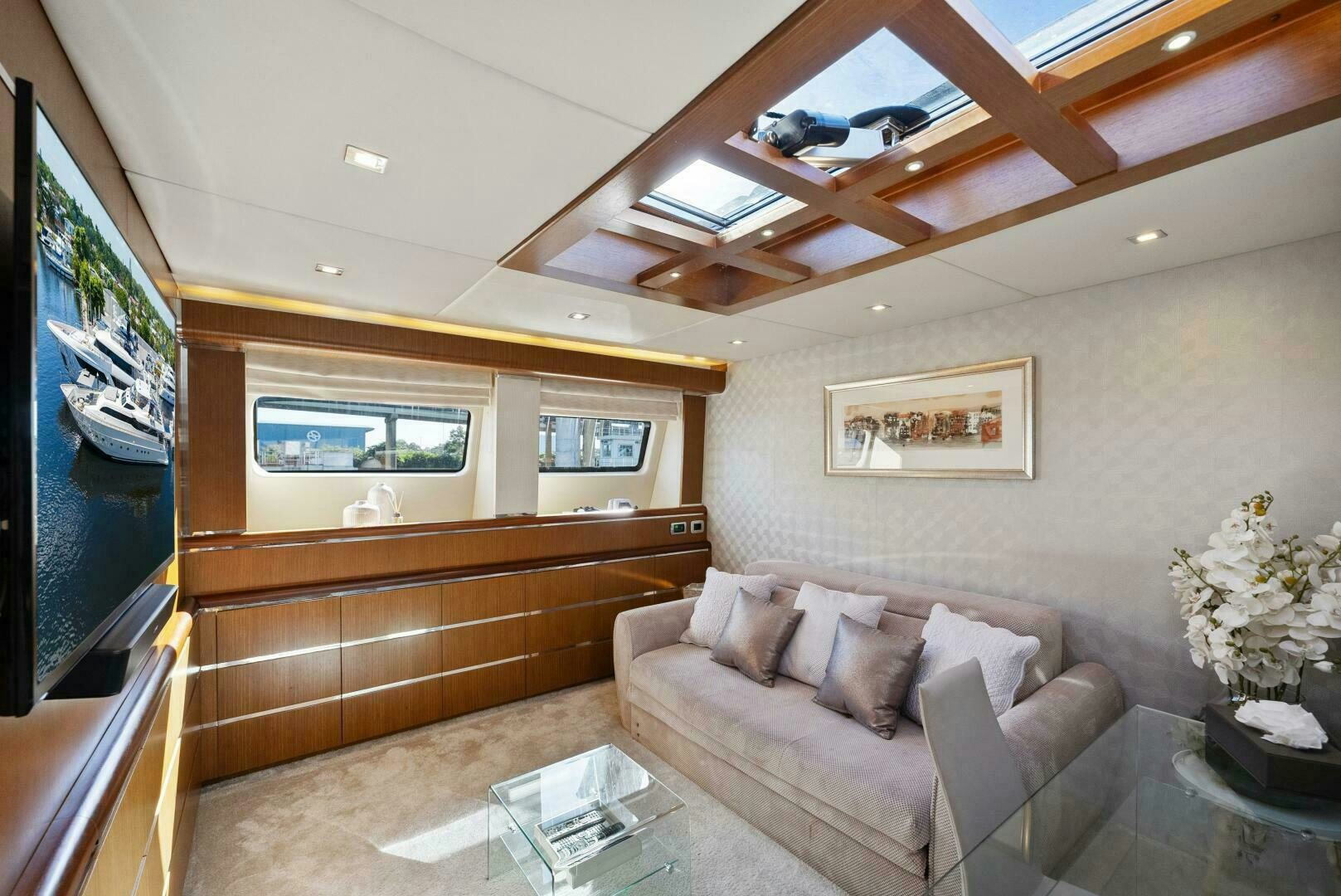 a living room with a large screen aboard PRINCESS LONA Yacht for Sale