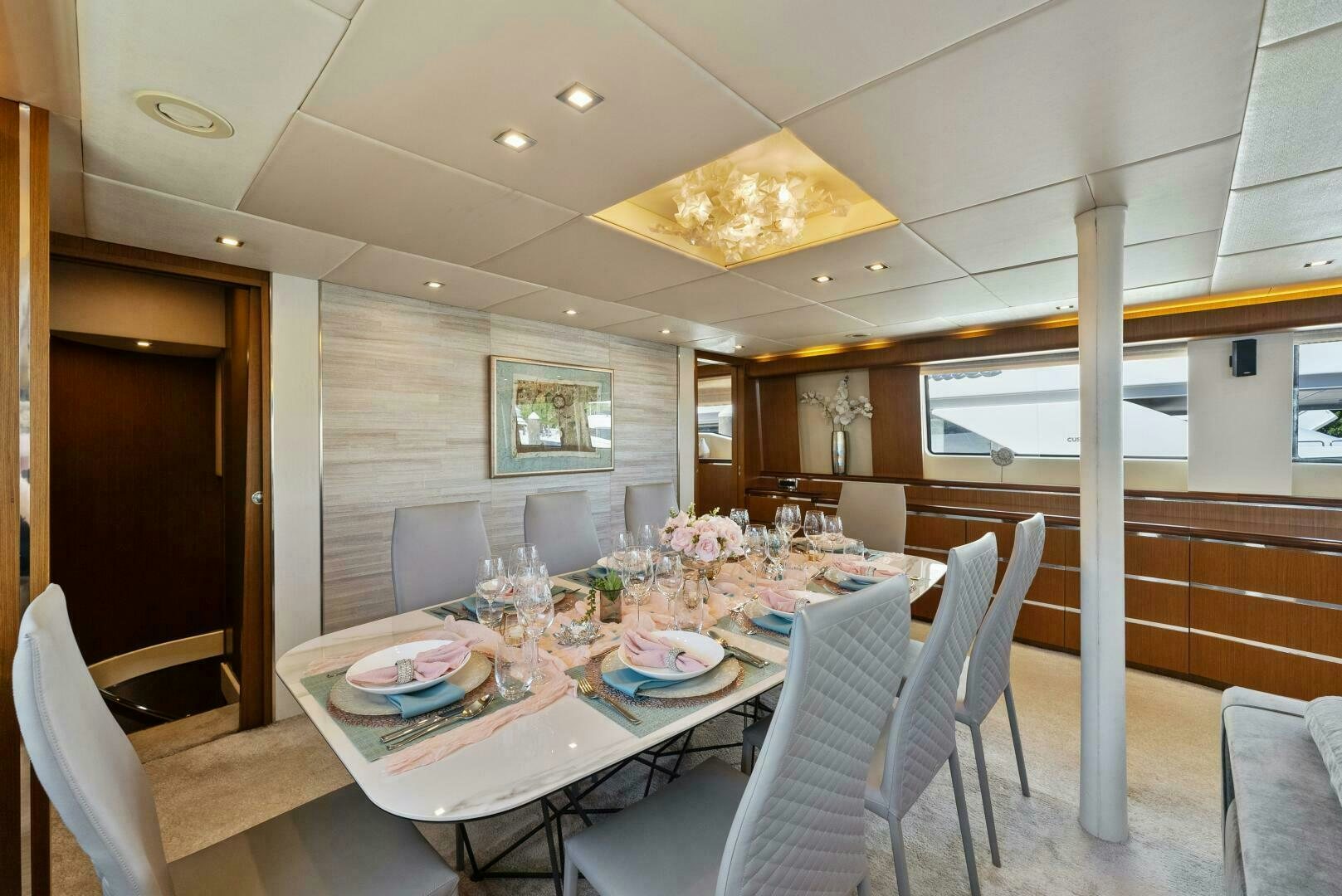 a dining room with a table and chairs aboard PRINCESS LONA Yacht for Sale