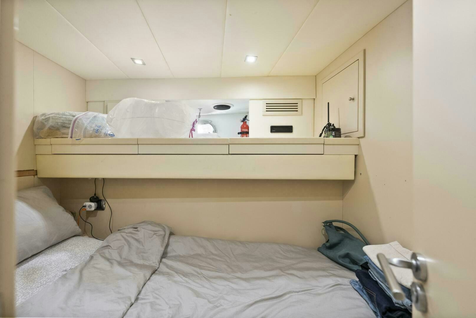 a bed with white sheets aboard PRINCESS LONA Yacht for Sale