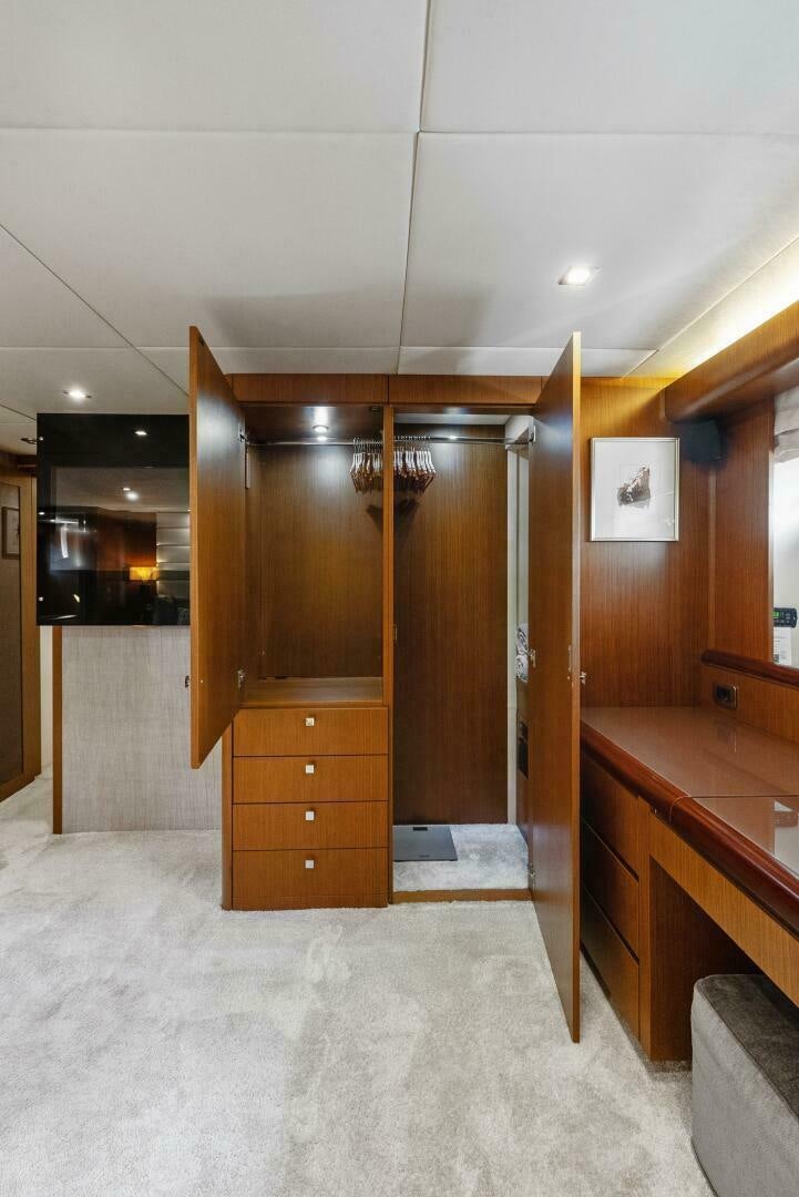 a room with wooden cabinets aboard PRINCESS LONA Yacht for Sale
