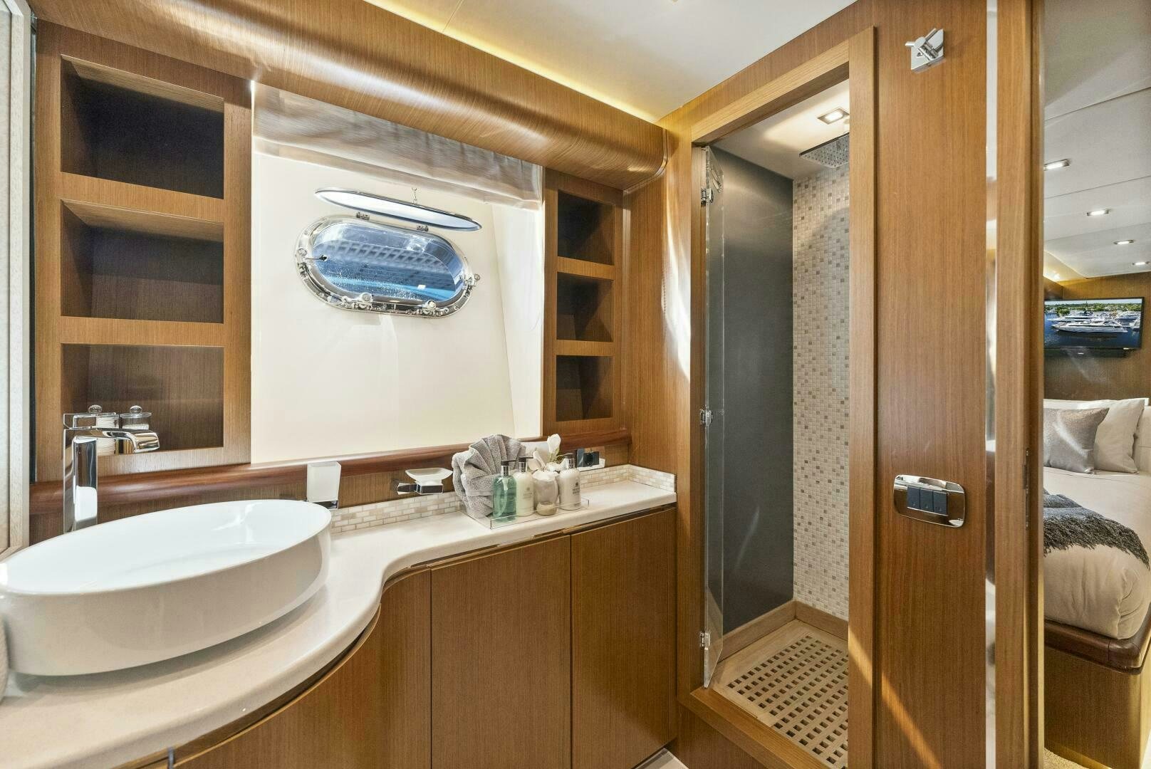a bathroom with a sink and a mirror aboard PRINCESS LONA Yacht for Sale