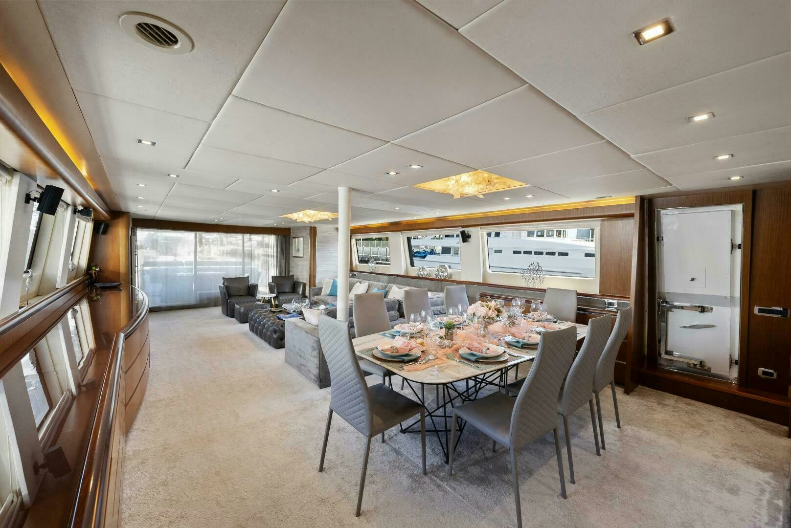 a large room with a table and chairs aboard PRINCESS LONA Yacht for Sale