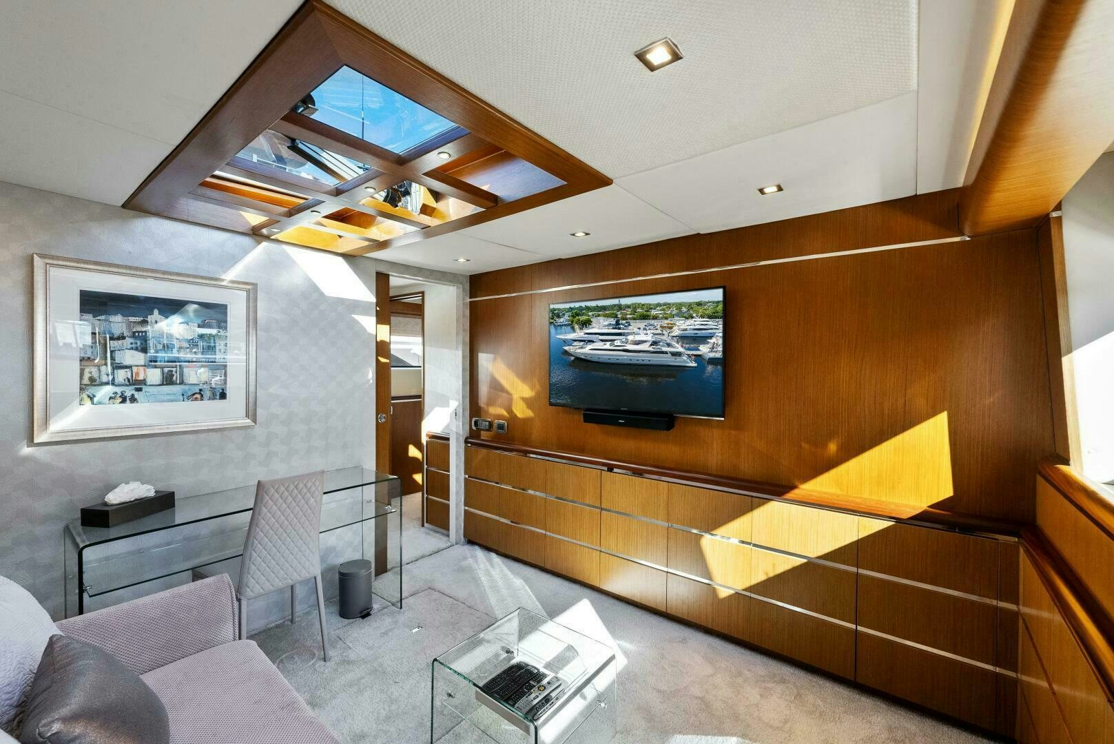 a room with a large wood wall and a large screen on the wall aboard PRINCESS LONA Yacht for Sale