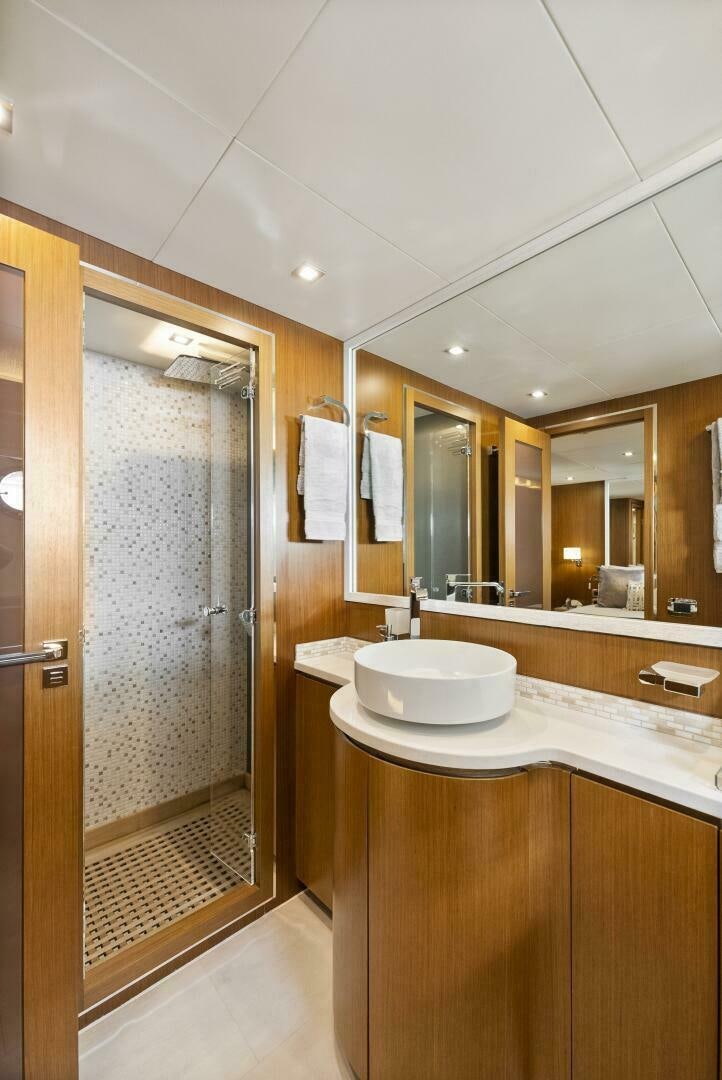 a bathroom with a sink and a shower aboard PRINCESS LONA Yacht for Sale