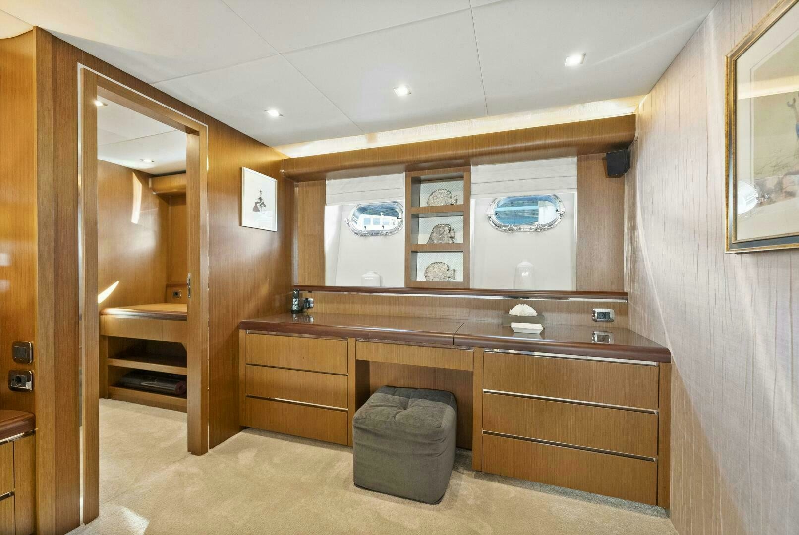 a room with a wood cabinet and a chair aboard PRINCESS LONA Yacht for Sale