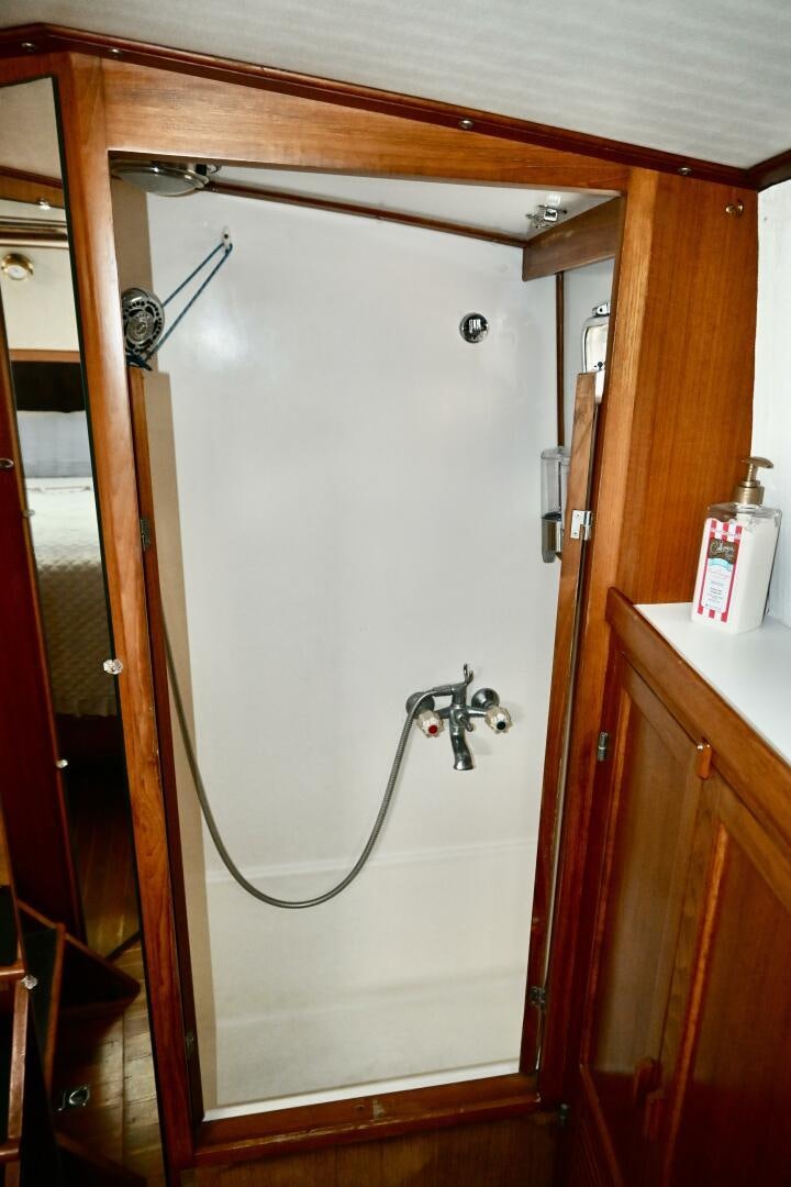 a shower unit with a hose attached aboard LITTLE BAYOU Yacht for Sale