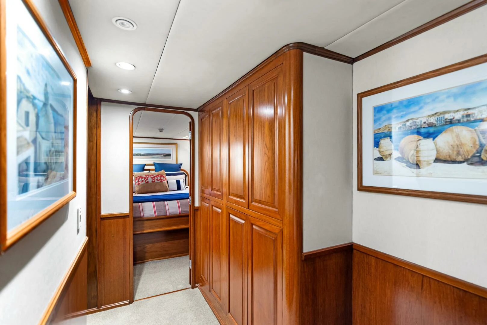 a room with a wood door and a wood closet aboard HUNTRESS Yacht for Sale