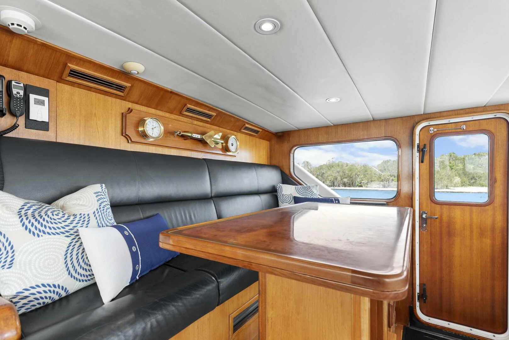 a room with a couch and a table aboard HUNTRESS Yacht for Sale