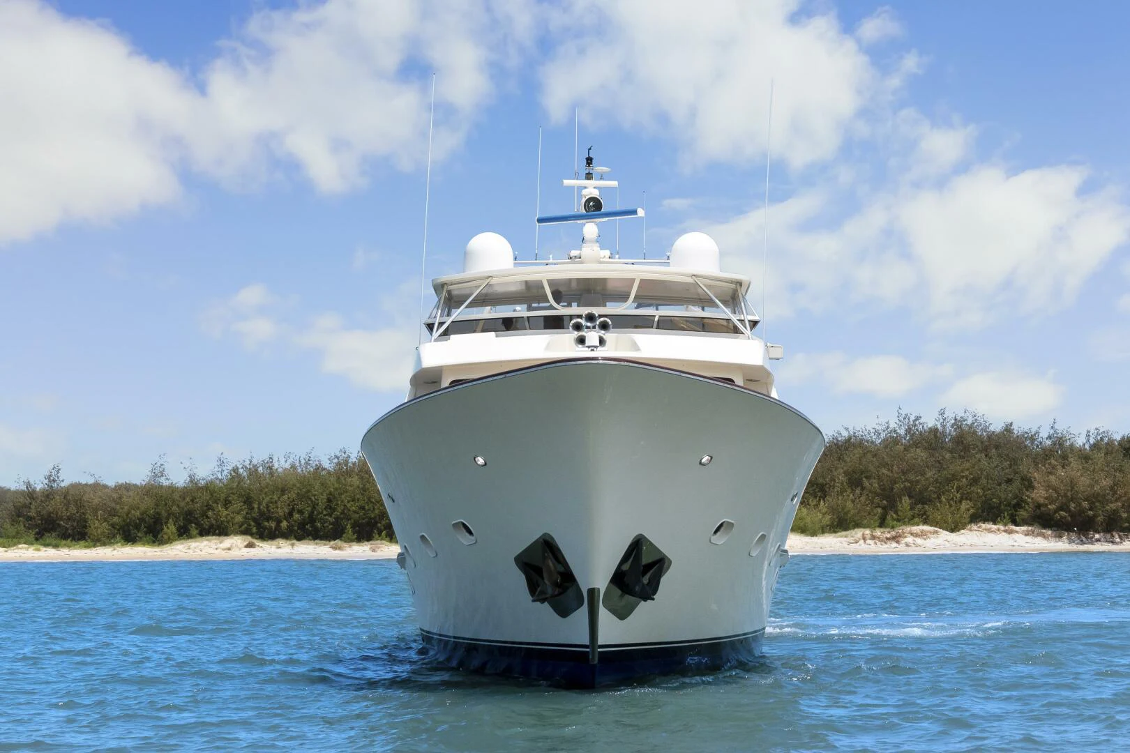 a white boat in the water aboard HUNTRESS Yacht for Sale