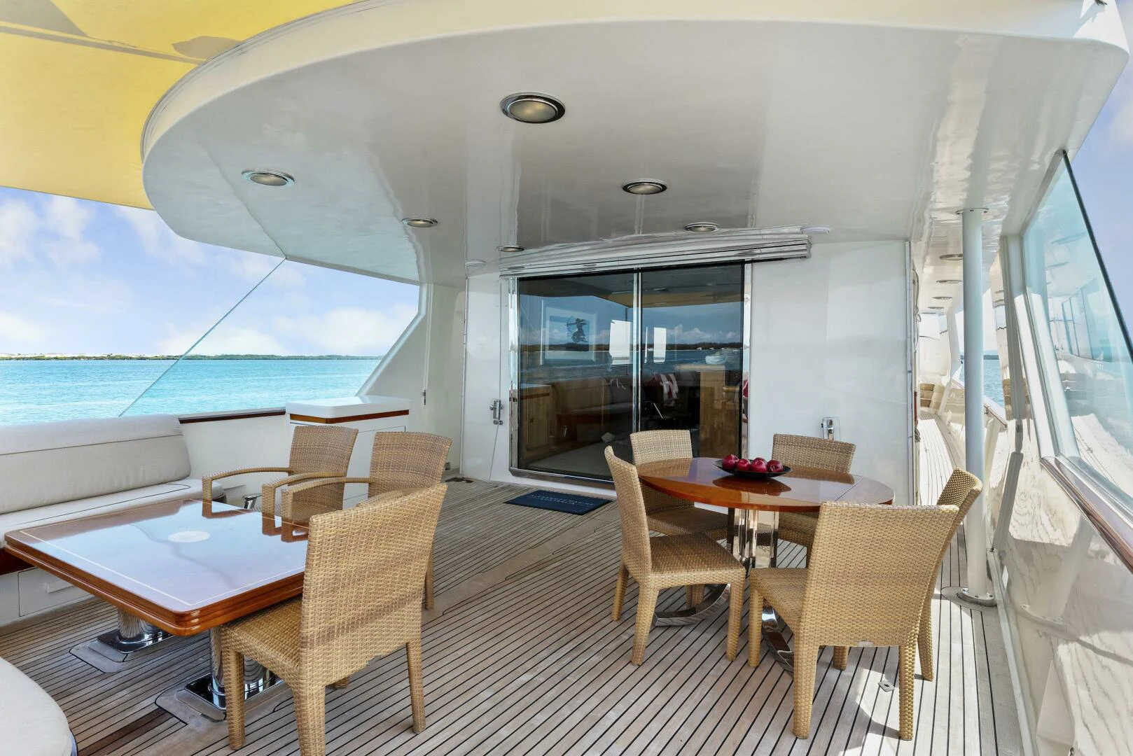 a large room with a table and chairs and a large window aboard HUNTRESS Yacht for Sale