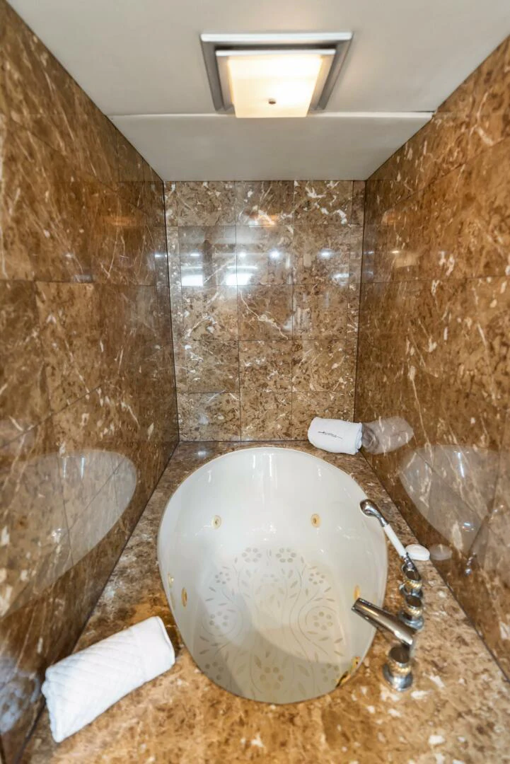 a dirty bathroom with a toilet aboard HUNTRESS Yacht for Sale