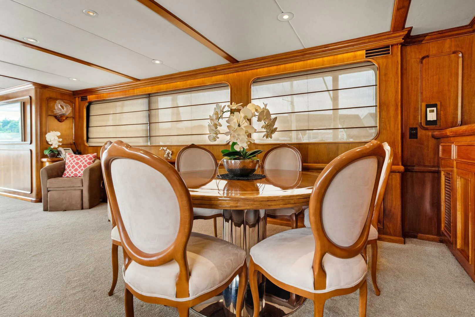 a dining room with chairs and a table aboard HUNTRESS Yacht for Sale