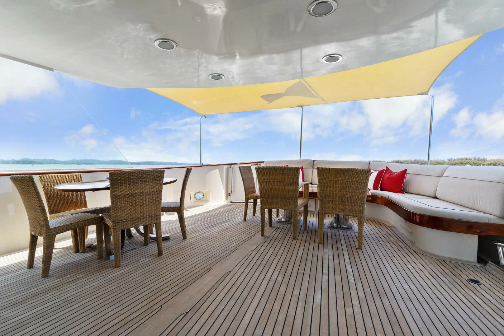 a room with a couch and a table and chairs aboard HUNTRESS Yacht for Sale