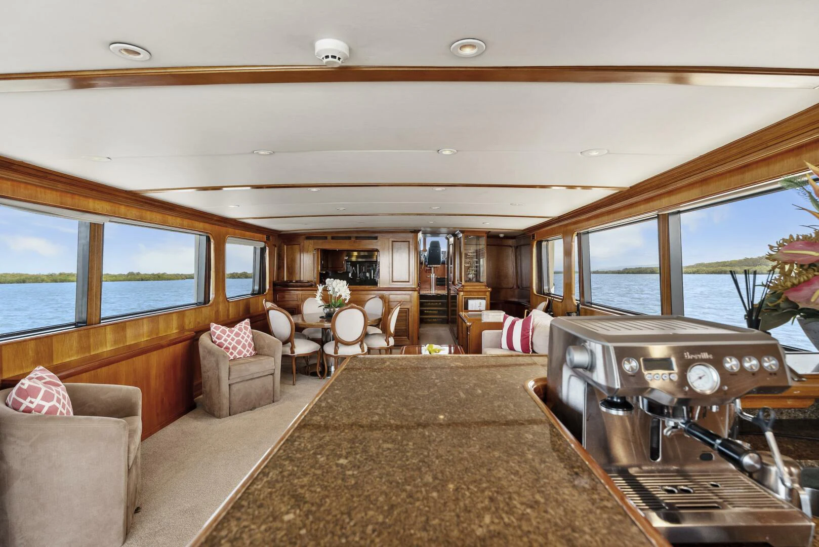 a living room with a piano aboard HUNTRESS Yacht for Sale