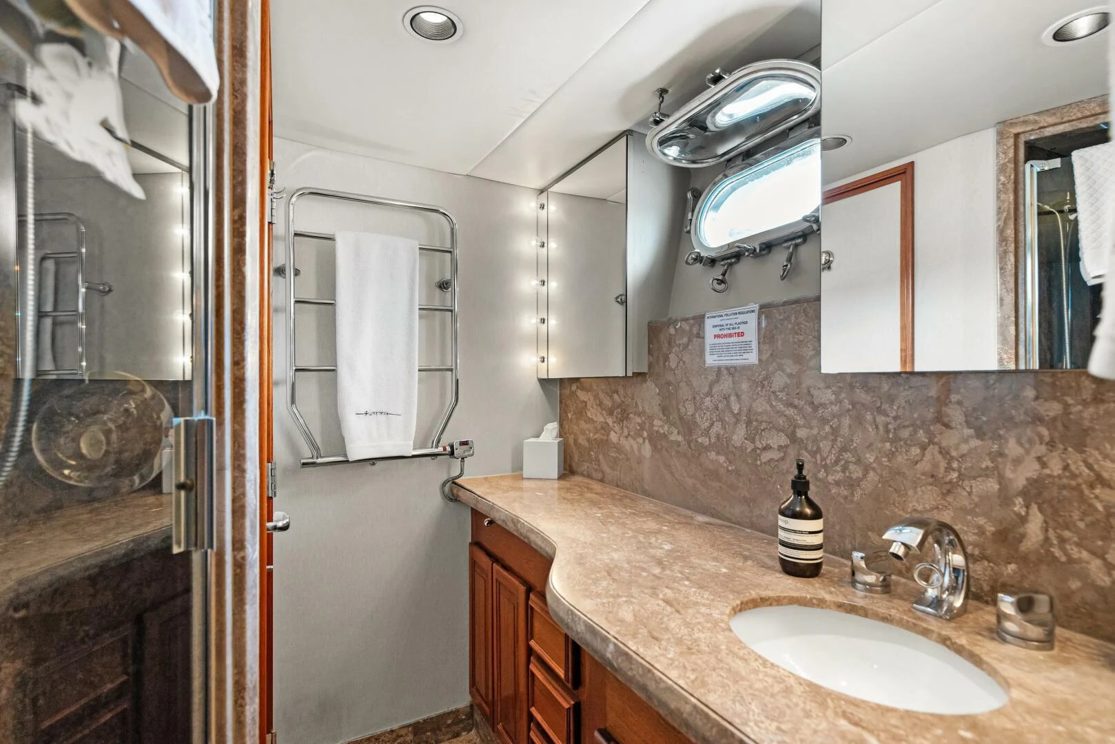 a bathroom with a countertop sink and mirror aboard HUNTRESS Yacht for Sale
