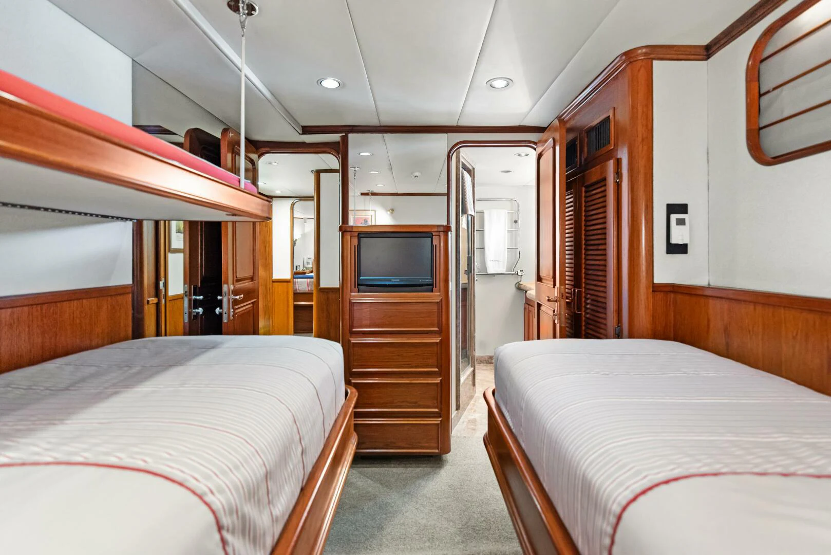 a room with two beds aboard HUNTRESS Yacht for Sale