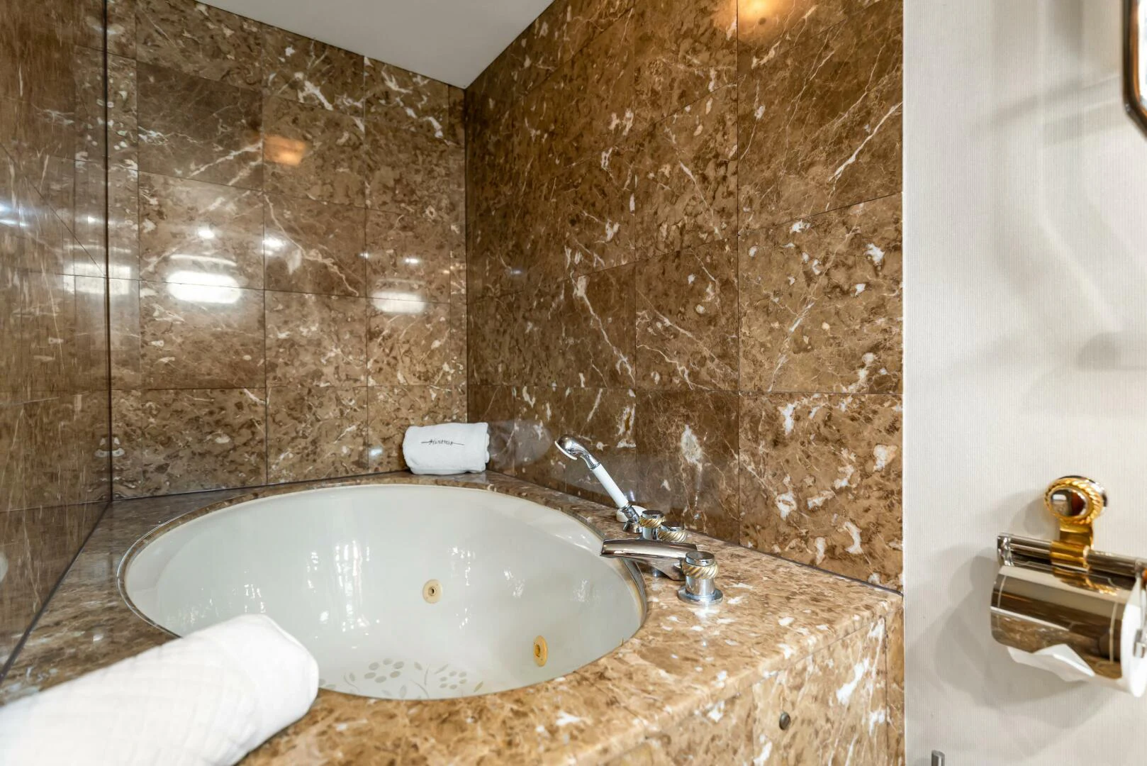a bathroom with a sink and a mirror aboard HUNTRESS Yacht for Sale