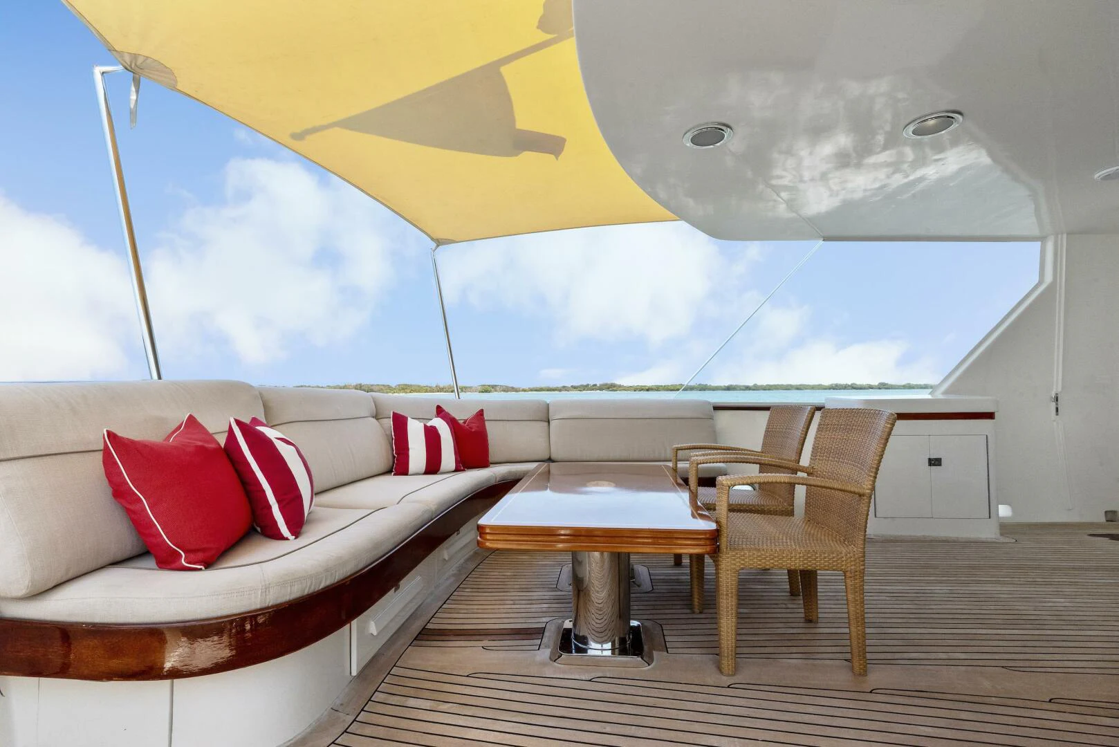a room with a couch and a table and chairs aboard HUNTRESS Yacht for Sale