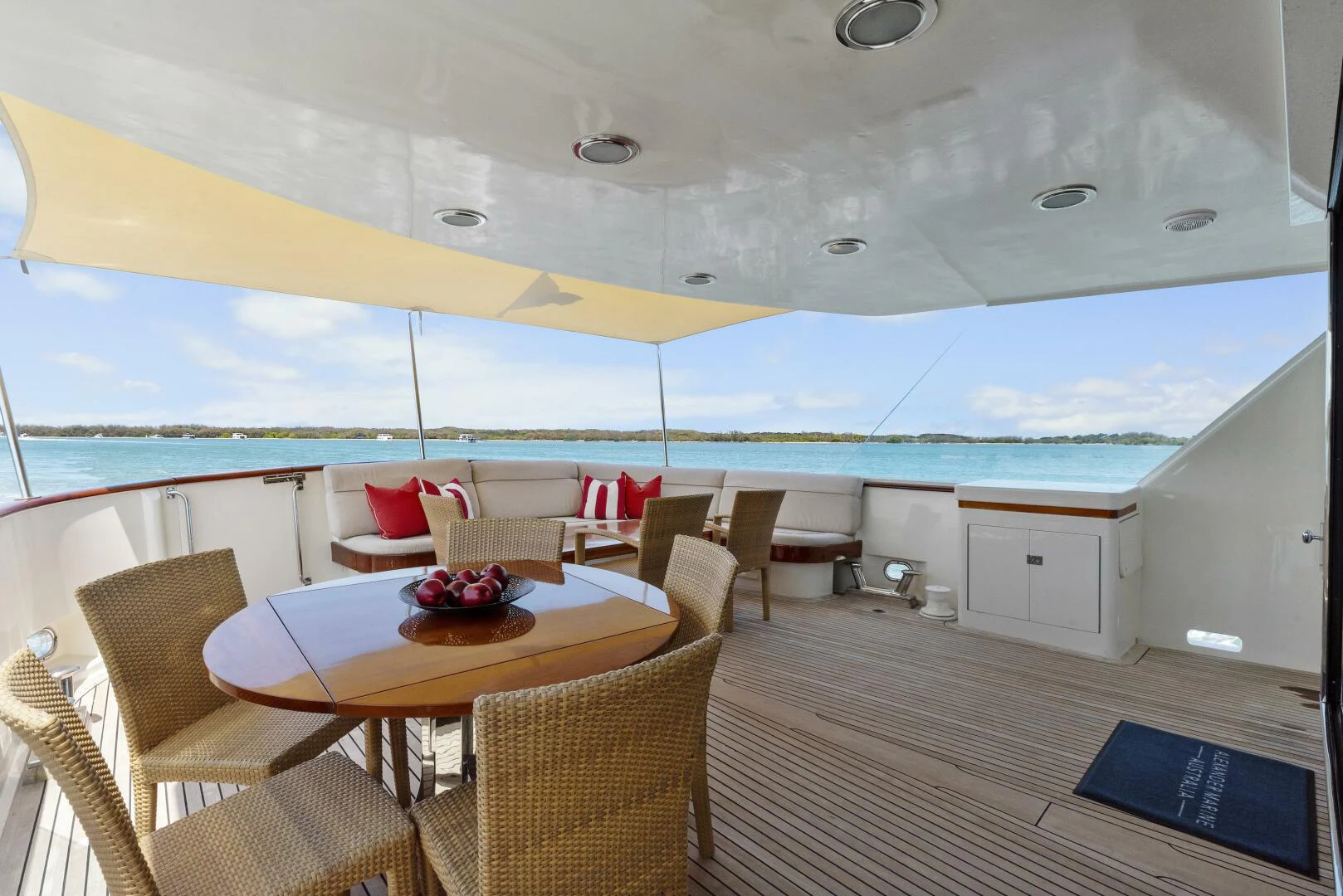 a boat with a table and chairs aboard HUNTRESS Yacht for Sale
