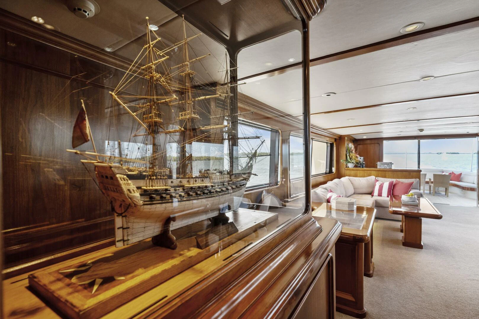 a large room with a large glass window and a couch aboard HUNTRESS Yacht for Sale