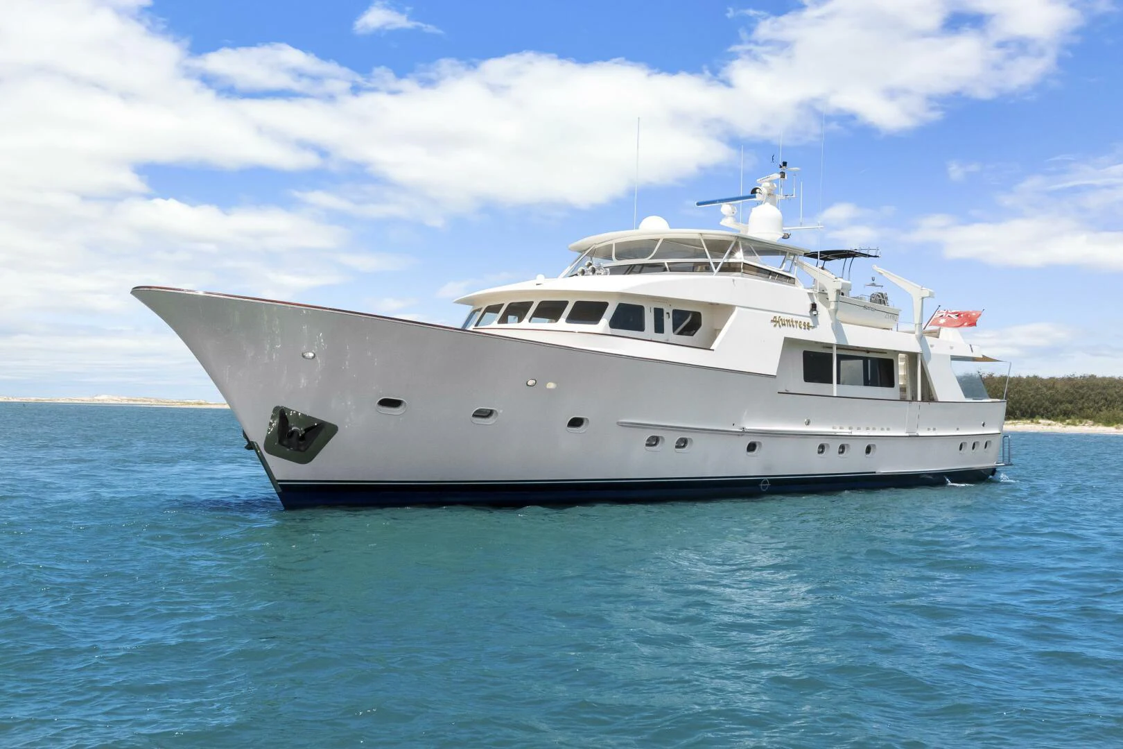 a white boat in the water aboard HUNTRESS Yacht for Sale