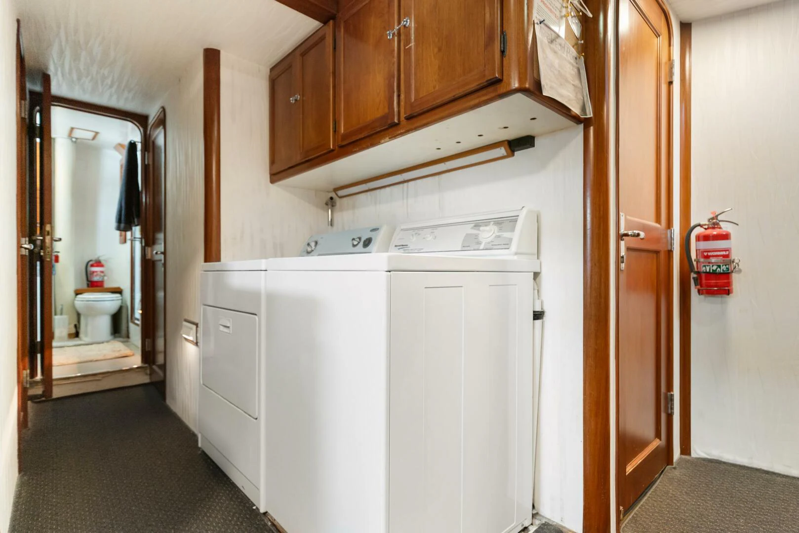 a kitchen with white cabinets aboard HUNTRESS Yacht for Sale