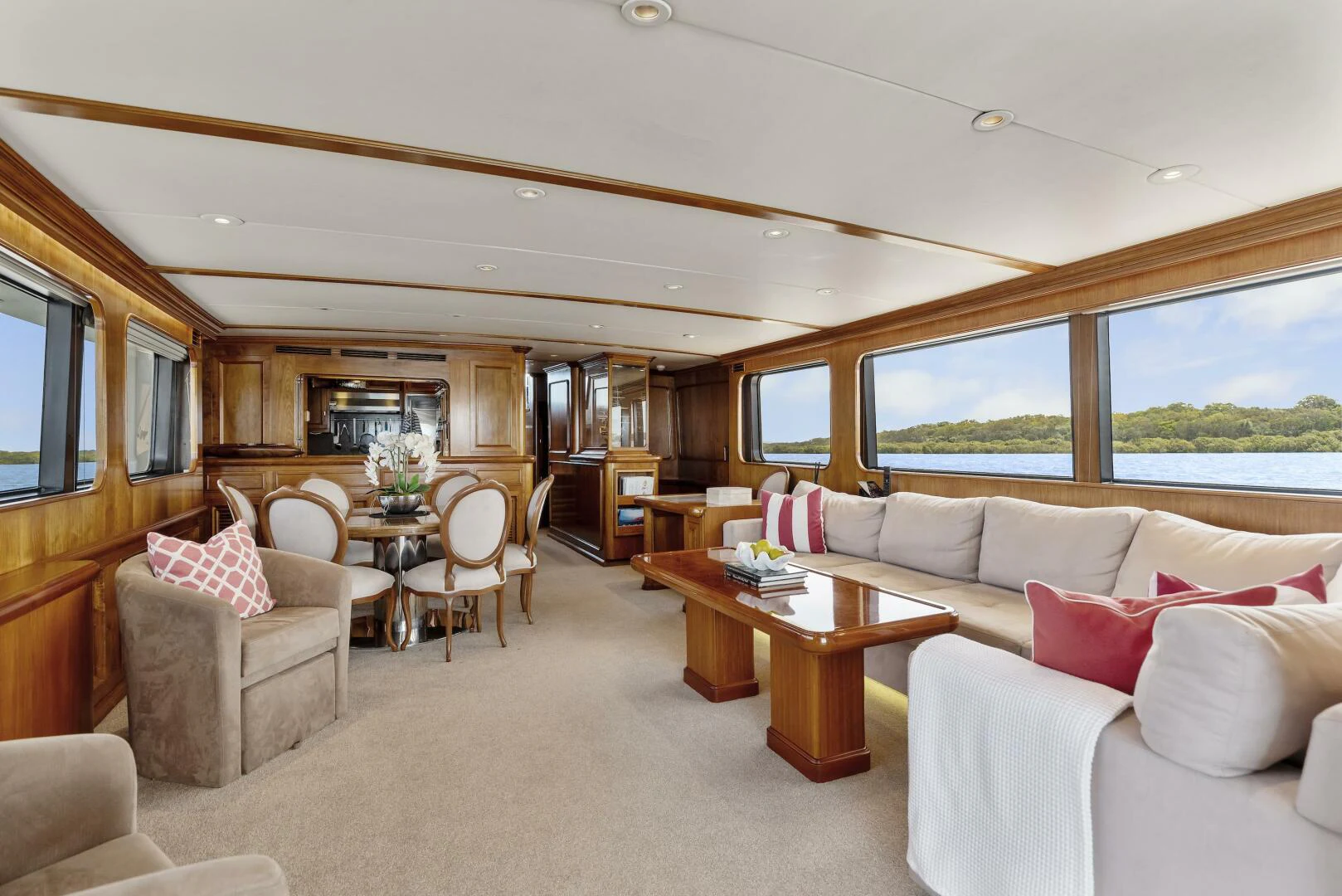 a living room with a couch and a table aboard HUNTRESS Yacht for Sale